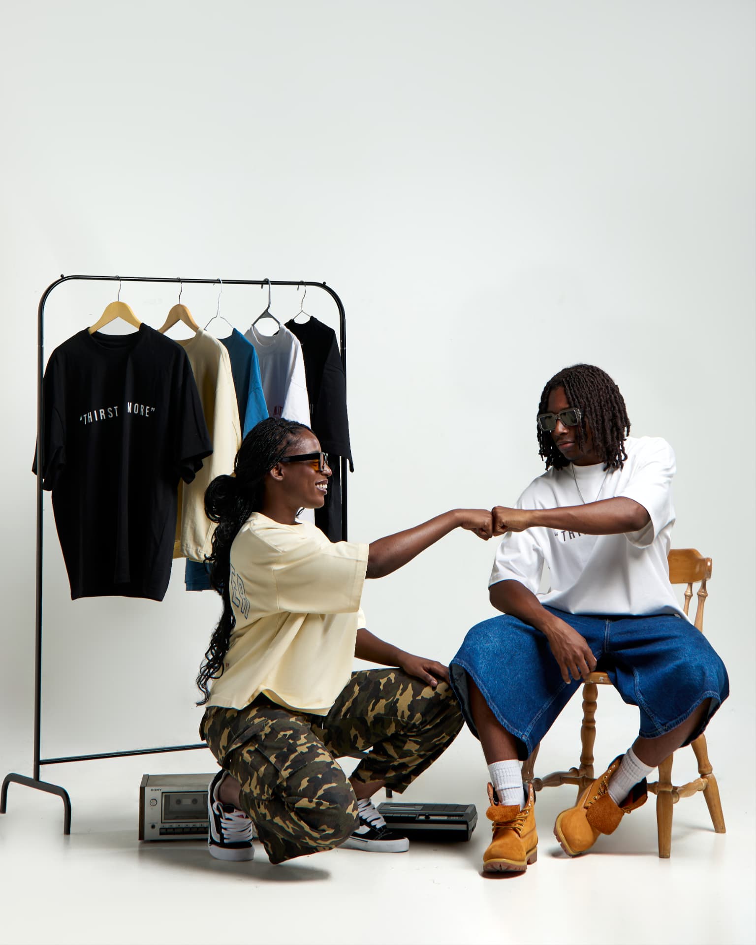 Two friends in Not of the World Apparel tees
